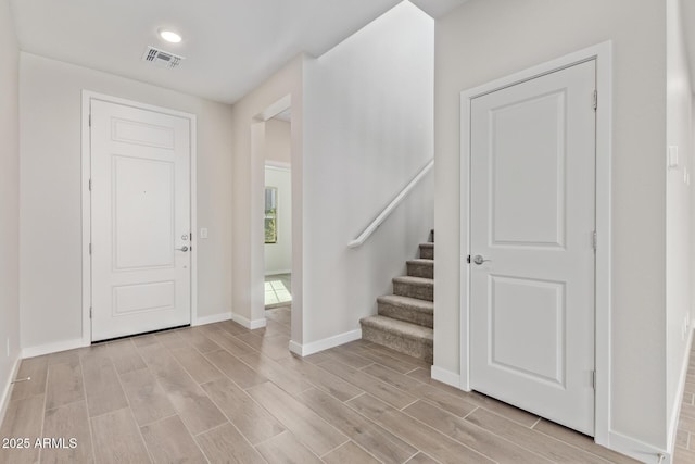 entryway with light hardwood / wood-style floors