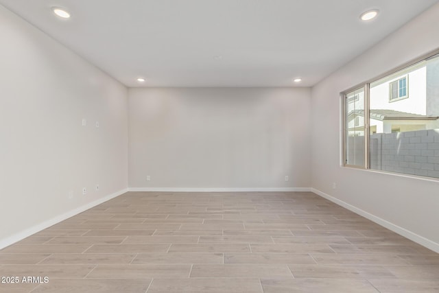 unfurnished room with light hardwood / wood-style floors