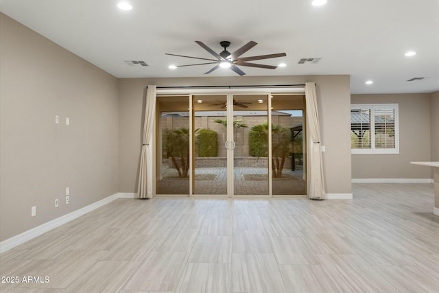 spare room with french doors and ceiling fan