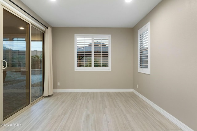 unfurnished room featuring a healthy amount of sunlight