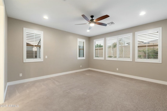 carpeted empty room featuring ceiling fan