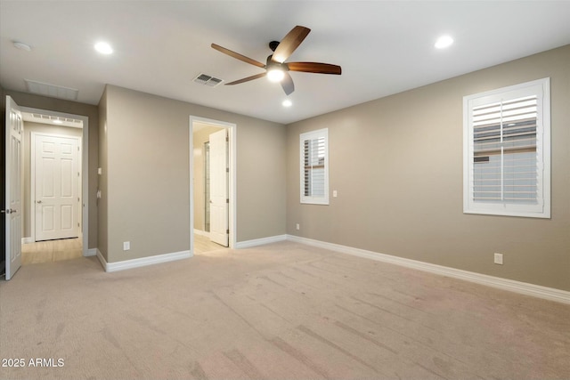 unfurnished bedroom with ensuite bathroom, ceiling fan, and light colored carpet