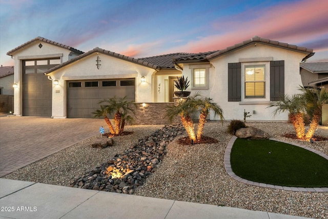 mediterranean / spanish-style home featuring a garage