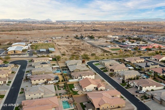 birds eye view of property featuring a mountain view