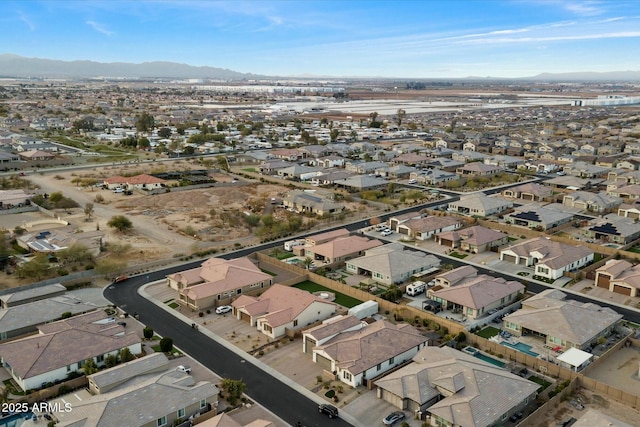 birds eye view of property with a mountain view