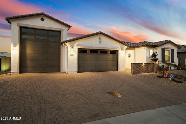 mediterranean / spanish-style home featuring a garage