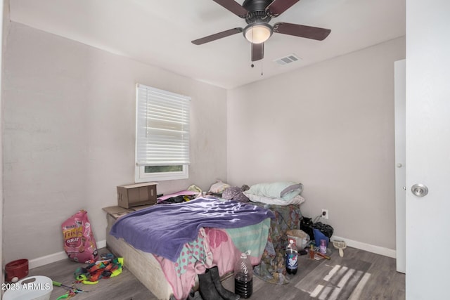 bedroom featuring hardwood / wood-style flooring and ceiling fan