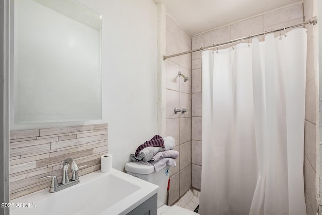 bathroom featuring vanity, toilet, and a shower with shower curtain