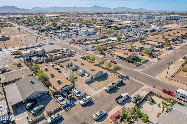 birds eye view of property with a mountain view