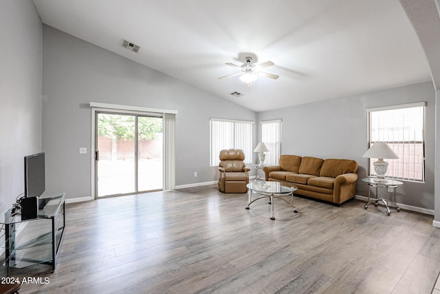 living room featuring ceiling fan, light hardwood / wood-style floors, and lofted ceiling