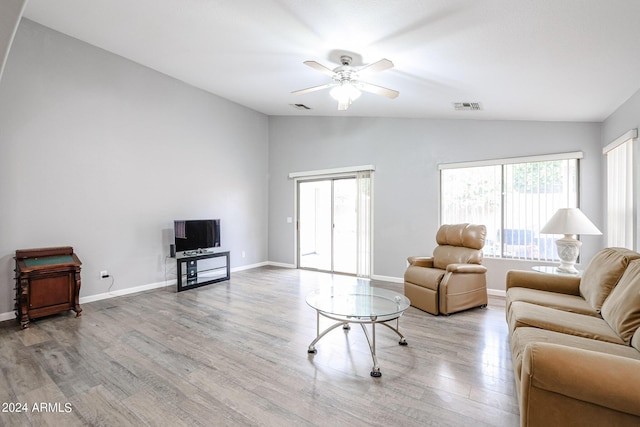 living room featuring light hardwood / wood-style flooring, ceiling fan, and lofted ceiling