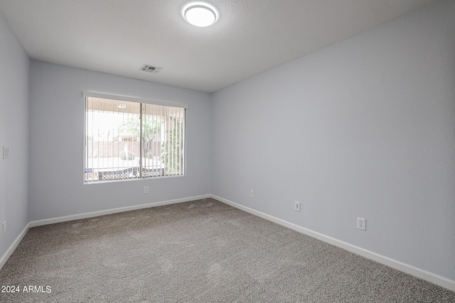 empty room with carpet flooring