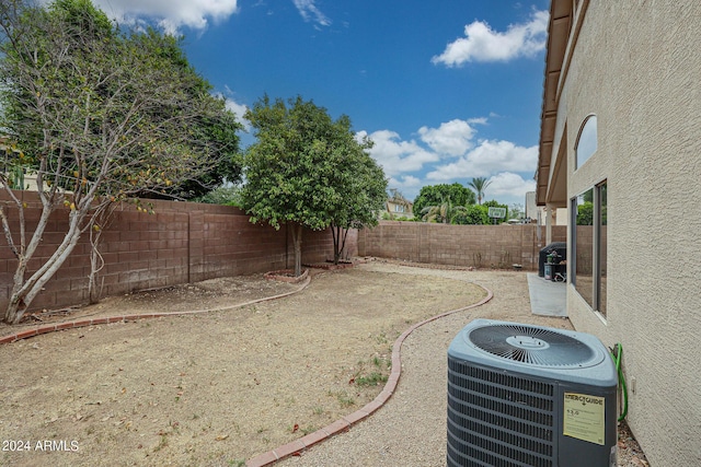 view of yard with central air condition unit