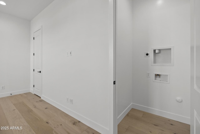 laundry room with baseboards, light wood finished floors, washer hookup, and hookup for an electric dryer