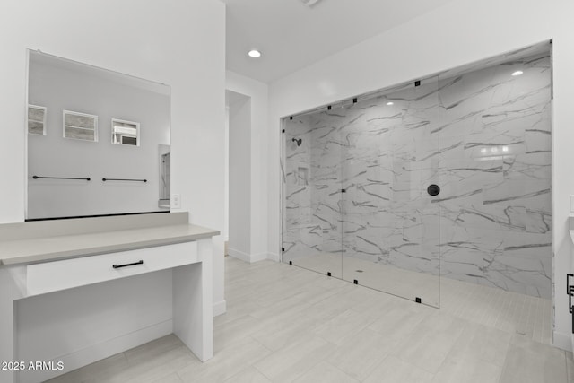 full bath featuring recessed lighting, a marble finish shower, and vanity