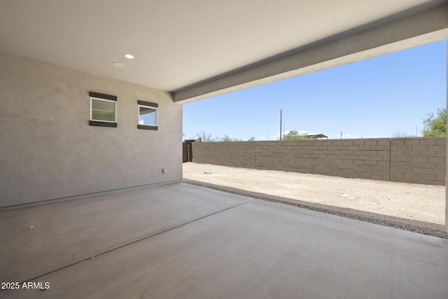 view of patio featuring fence