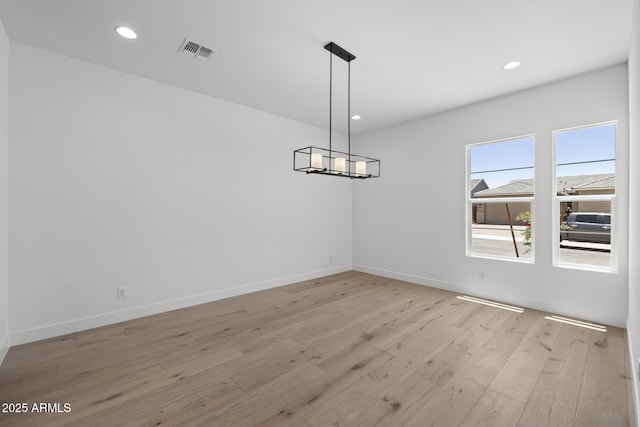 unfurnished dining area featuring recessed lighting, baseboards, visible vents, and light wood finished floors