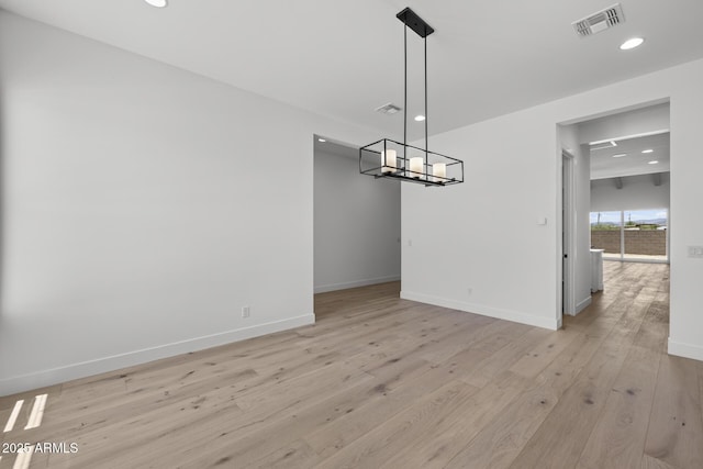 unfurnished dining area featuring recessed lighting, baseboards, visible vents, and light wood finished floors