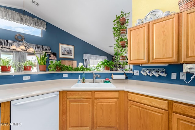 kitchen featuring visible vents, a sink, white dishwasher, a chandelier, and vaulted ceiling