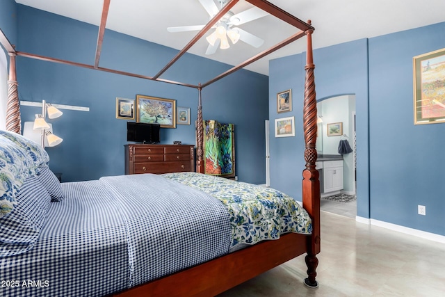 bedroom featuring ceiling fan, baseboards, arched walkways, and finished concrete floors