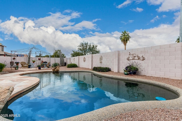 view of swimming pool featuring a gazebo, a fenced in pool, a fenced backyard, and a patio area