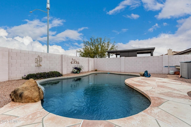 view of swimming pool featuring a patio, a fenced backyard, and a fenced in pool