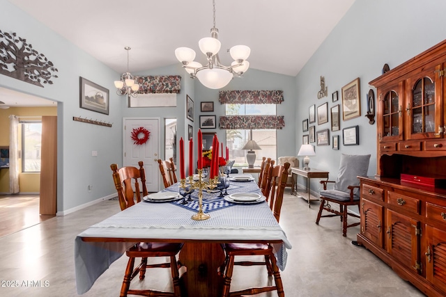 dining space featuring high vaulted ceiling, baseboards, and a chandelier