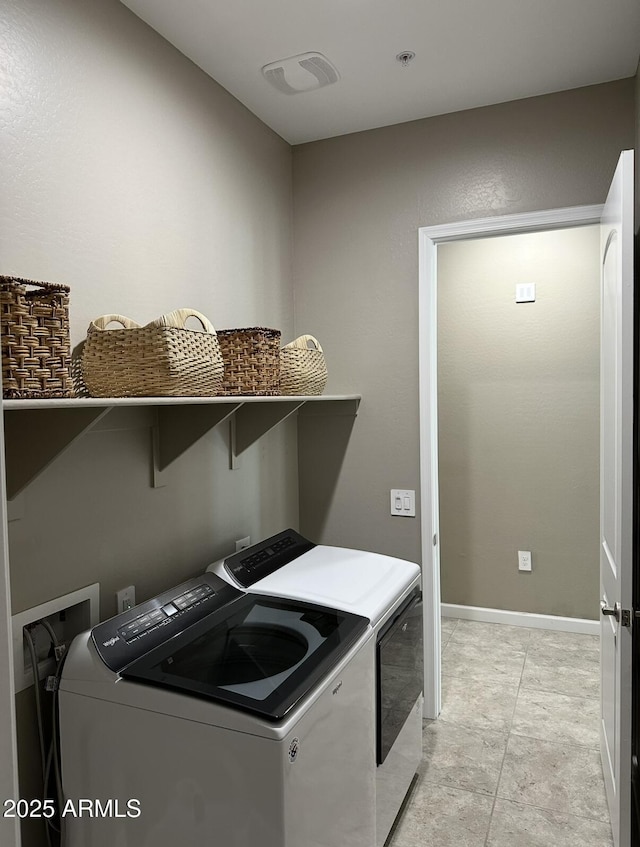 1255 N Arizona Ave Unit 1235, Chandler, AZ 85225 - washroom featuring washing machine and clothes dryer and baseboards