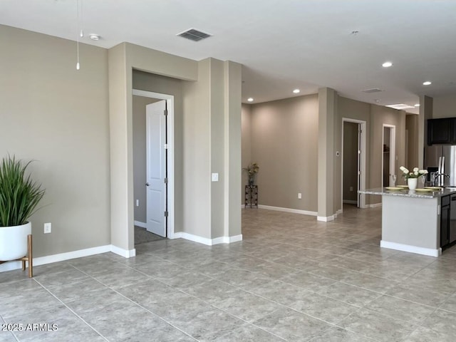 1255 N Arizona Ave Unit 1235, Chandler, AZ 85225 - unfurnished living room with light tile patterned floors and recessed lighting