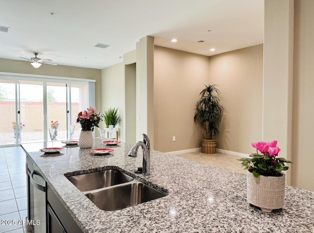 1255 N Arizona Ave Unit 1235, Chandler, AZ 85225 - kitchen featuring tile patterned floors, light stone countertops, ceiling fan, stainless steel dishwasher, and recessed lighting
