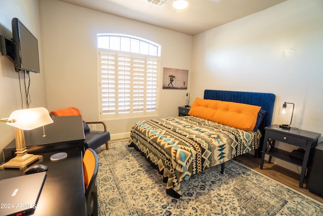 bedroom featuring hardwood / wood-style floors and ceiling fan