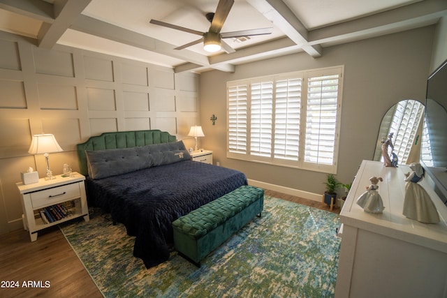 bedroom with beam ceiling, hardwood / wood-style floors, coffered ceiling, and ceiling fan