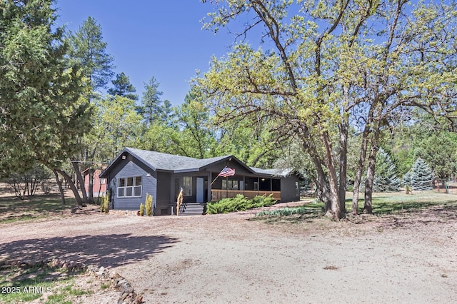 3440 N Meadow Dr, Pine, AZ 85544 - ranch-style home with a porch and dirt driveway