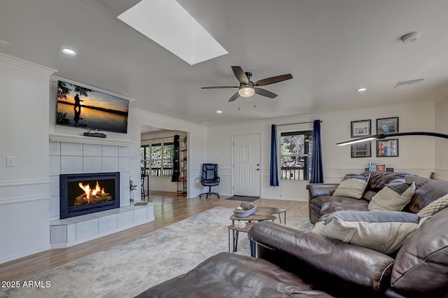 3440 N Meadow Dr, Pine, AZ 85544 - living area featuring a tile fireplace, healthy amount of natural light, wood finished floors, recessed lighting, and ornamental molding