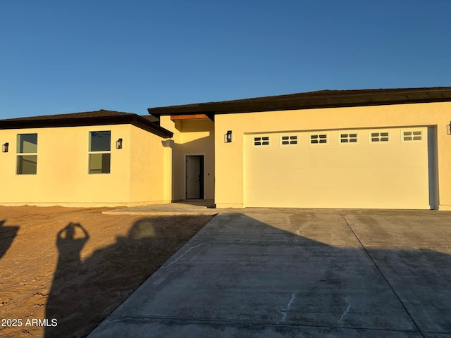 3627 W Palmaire Ave, Phoenix, AZ 85051 - view of front of property featuring stucco siding, concrete driveway, and an attached garage