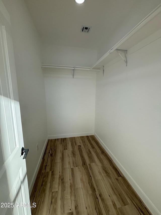 3627 W Palmaire Ave, Phoenix, AZ 85051 - spacious closet featuring wood finished floors