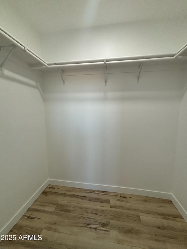 3627 W Palmaire Ave, Phoenix, AZ 85051 - walk in closet with wood finished floors