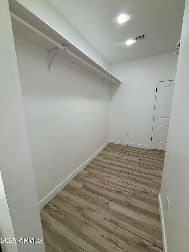 3627 W Palmaire Ave, Phoenix, AZ 85051 - spacious closet featuring wood finished floors