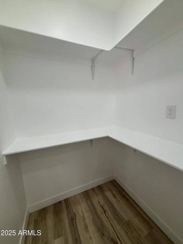 3627 W Palmaire Ave, Phoenix, AZ 85051 - walk in closet with wood finished floors