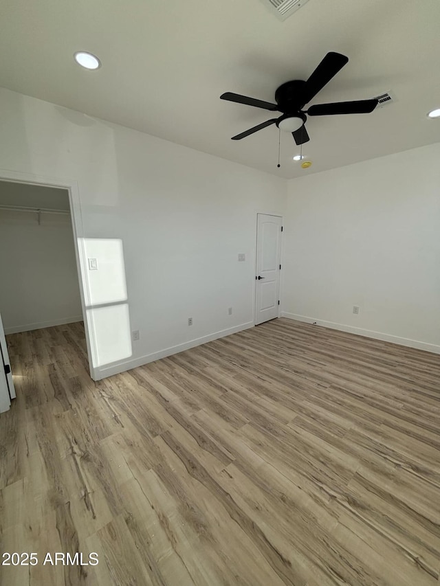 3627 W Palmaire Ave, Phoenix, AZ 85051 - spare room featuring light wood-style floors, ceiling fan, recessed lighting, and baseboards
