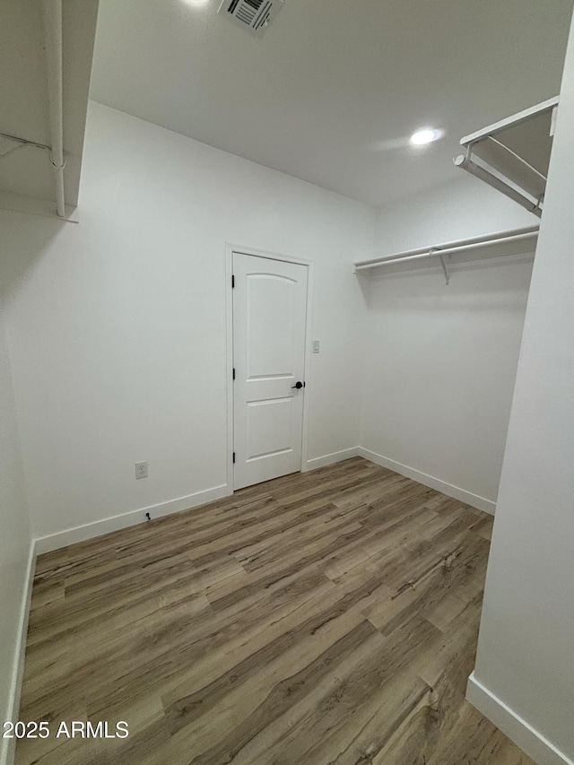 3627 W Palmaire Ave, Phoenix, AZ 85051 - spacious closet featuring wood finished floors