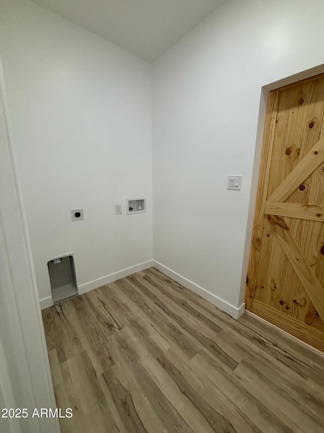 3627 W Palmaire Ave, Phoenix, AZ 85051 - laundry room featuring wood finished floors, hookup for an electric dryer, washer hookup, and baseboards