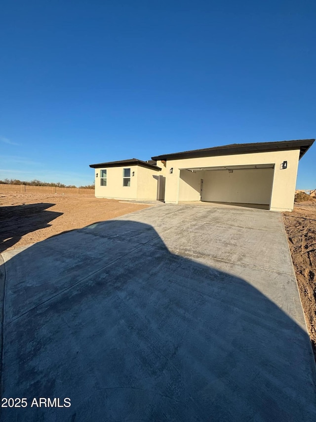 3627 W Palmaire Ave, Phoenix, AZ 85051 - ranch-style house with a garage, stucco siding, and concrete driveway