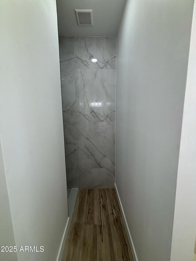 3627 W Palmaire Ave, Phoenix, AZ 85051 - bathroom with wood finished floors and a marble finish shower