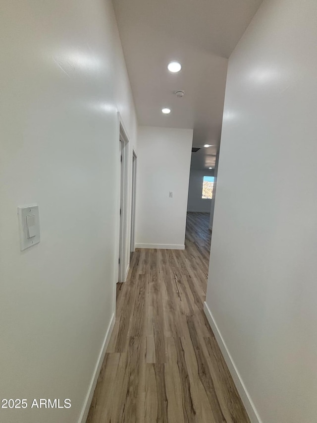 3627 W Palmaire Ave, Phoenix, AZ 85051 - hallway featuring wood finished floors, baseboards, and recessed lighting