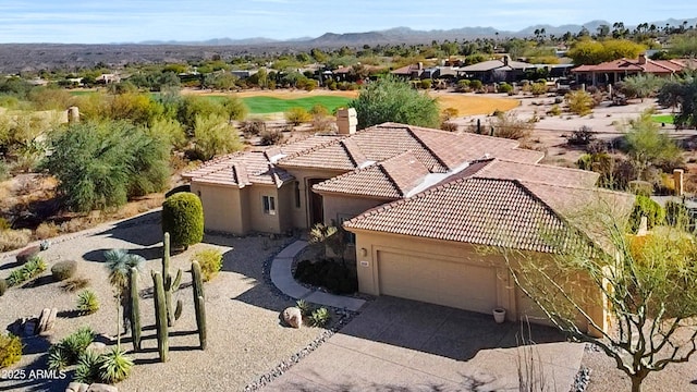 drone / aerial view featuring a residential view and a mountain view