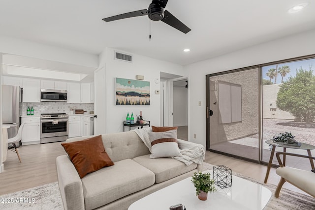 515 S Saguaro Way, Mesa, AZ 85208 - living area featuring light wood finished floors, a ceiling fan, and recessed lighting