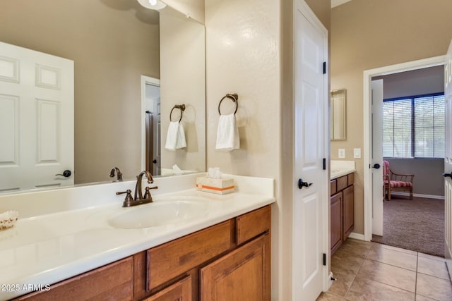 16758 W Apache St, Goodyear, AZ 85338 - bathroom with vanity, tile patterned flooring, and baseboards