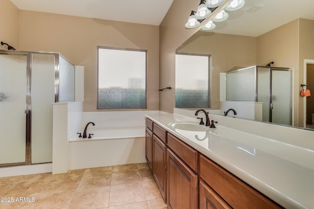 16758 W Apache St, Goodyear, AZ 85338 - bathroom featuring a stall shower, a garden tub, and vanity