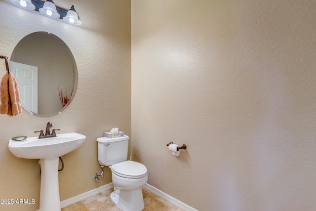 16758 W Apache St, Goodyear, AZ 85338 - bathroom with toilet and baseboards